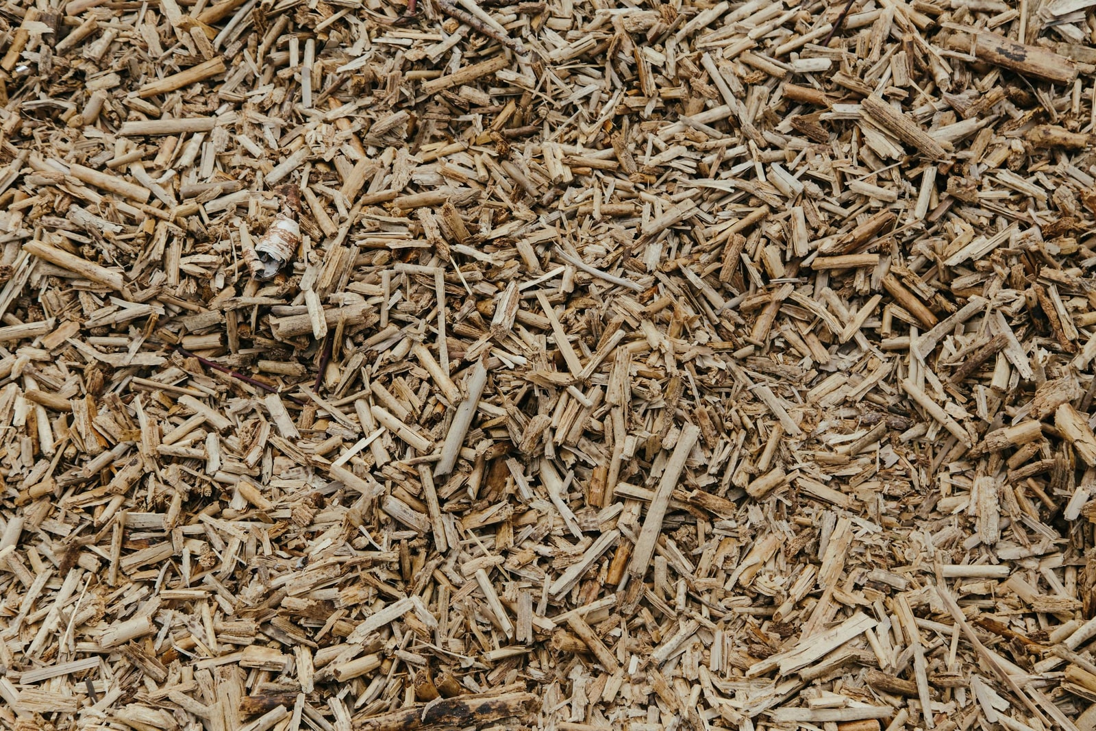 Natural brown wood chip mulch with visible chunks and varied texture